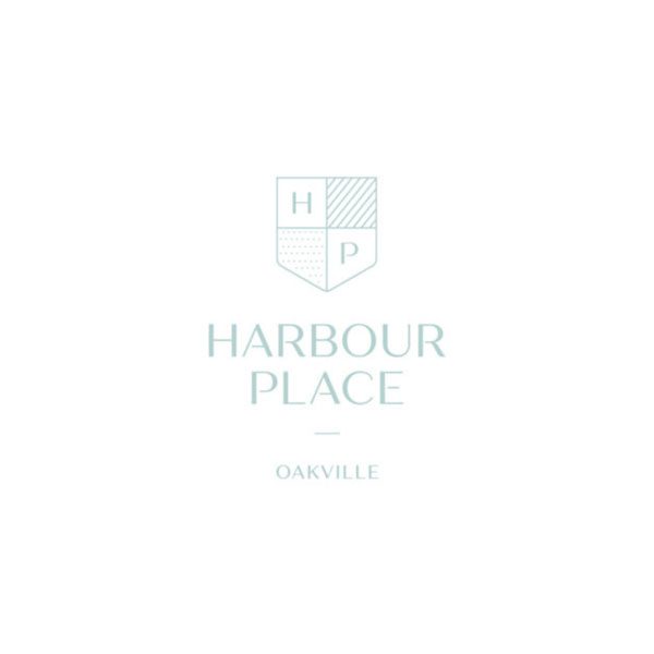 A white logo of the harbour place hotel.