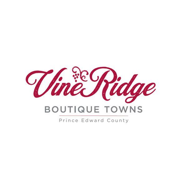 A red and white logo for vine ridge boutique towns.