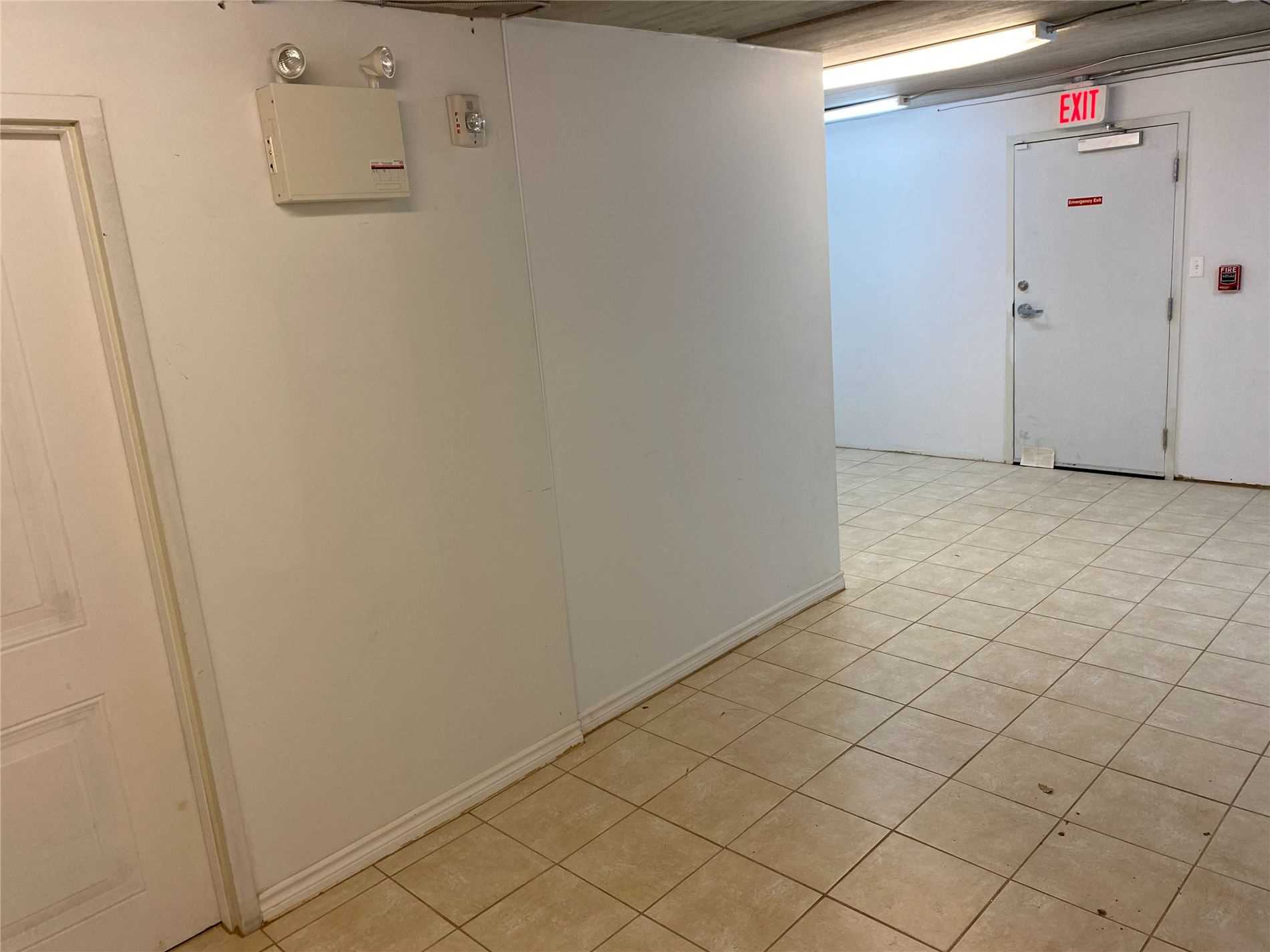 A room with tiled floors and white walls.