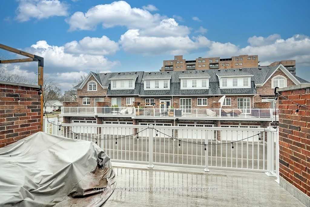 A view of some buildings and a fence.