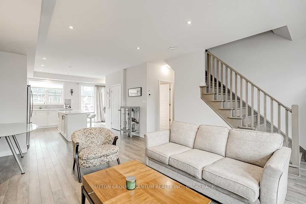 A living room with white walls and furniture.