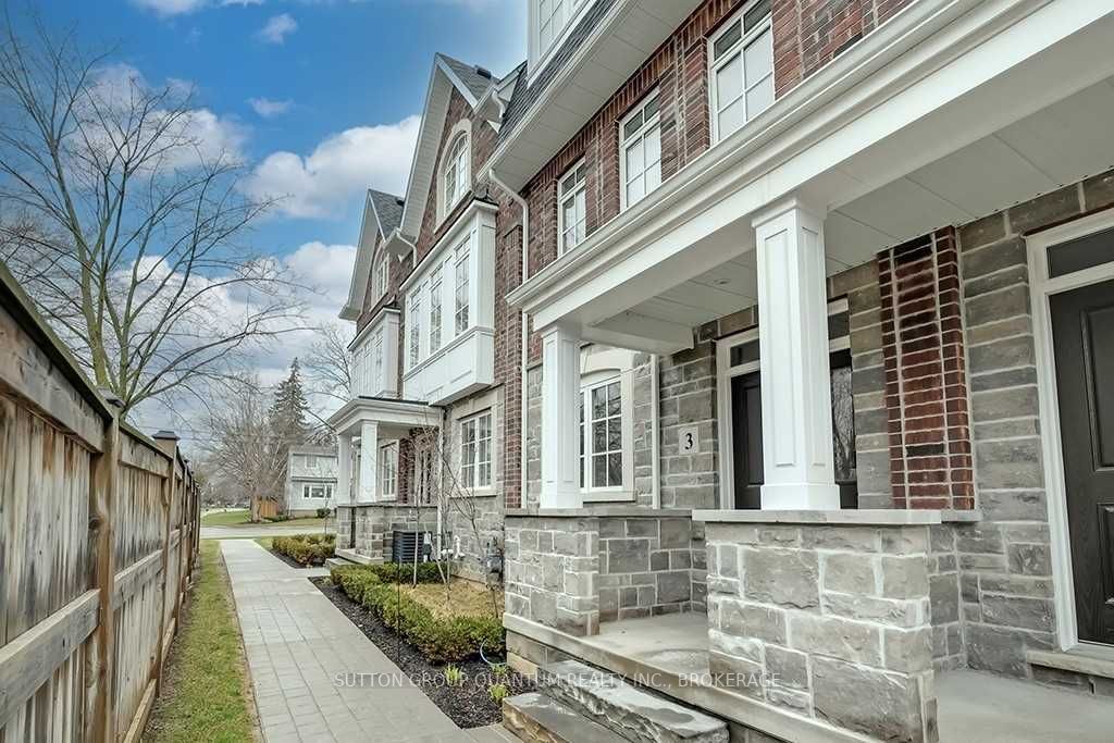 A row of houses with pillars and windows.