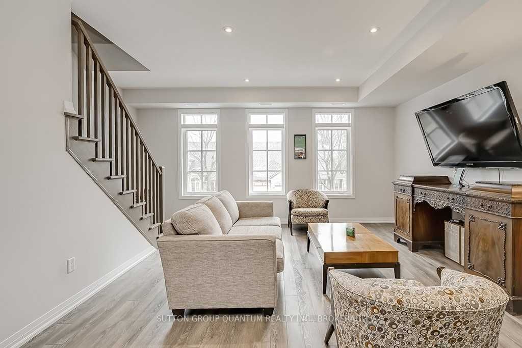 A living room with stairs and a couch