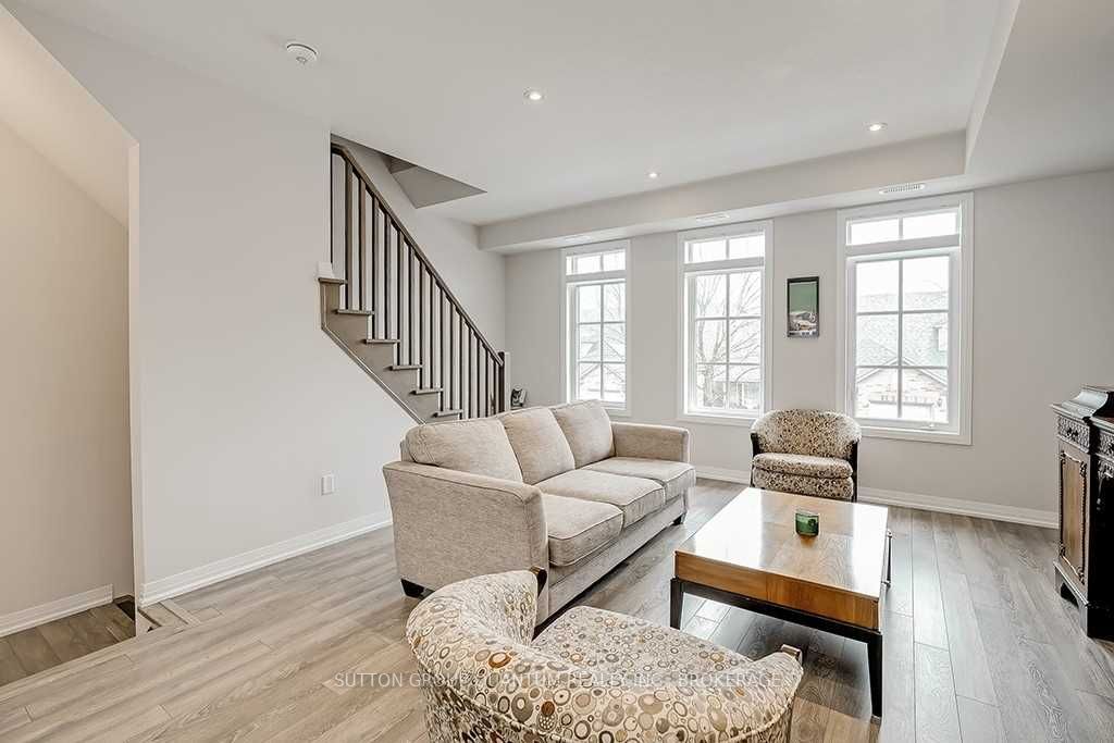 A living room with stairs and a couch