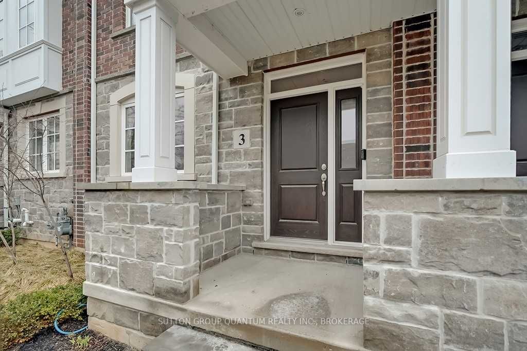 A front door of a house with brick walls.