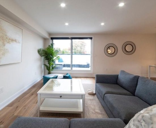 A living room with a couch and table