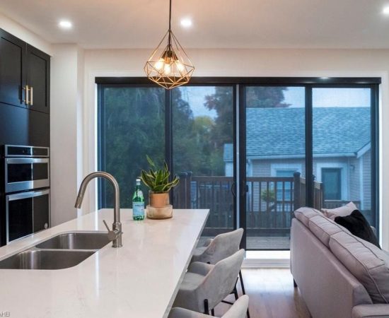 A kitchen with a sink and a window