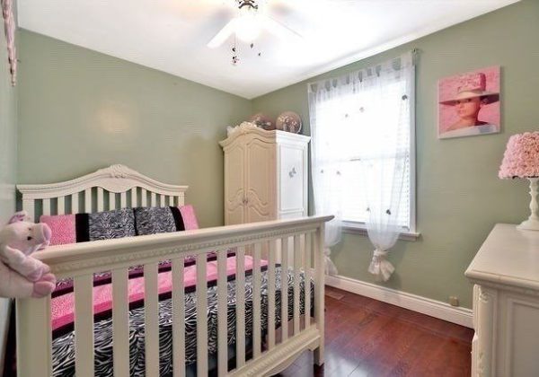 A baby 's room with a crib and a dresser.