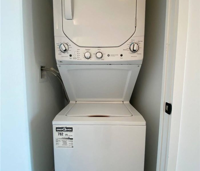 A white washer and dryer in a room.