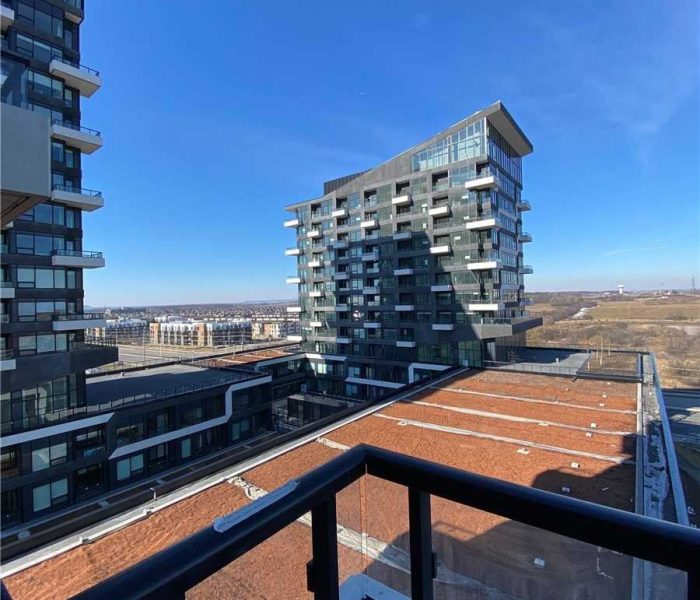 A view of the city from an apartment balcony.