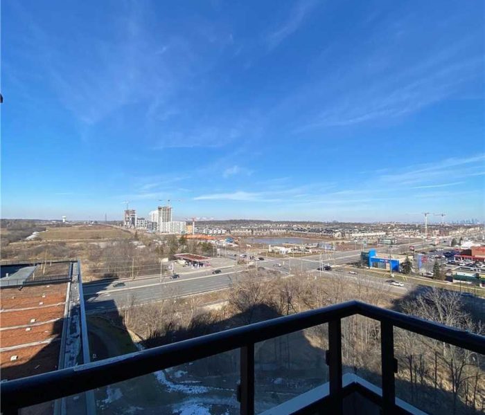 A view of the city from an apartment balcony.