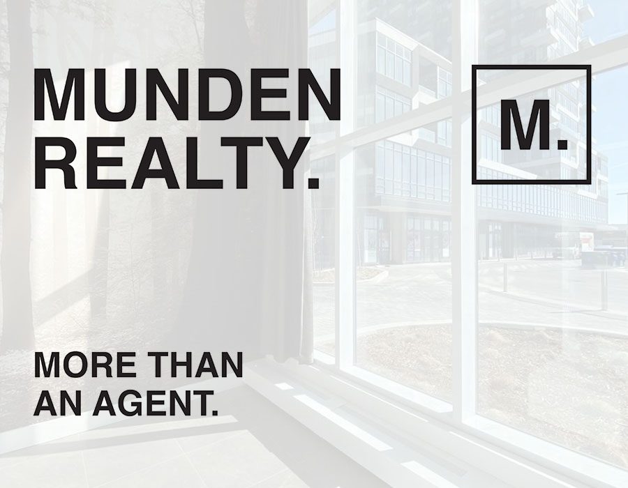 A window with the words munden realty on it.